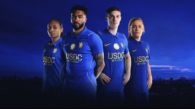 A promotional photo of four Chelsea football players wearing the team's blue kit featuring the 'USDC BY CIRCLE' sponsor logo on the chest.
