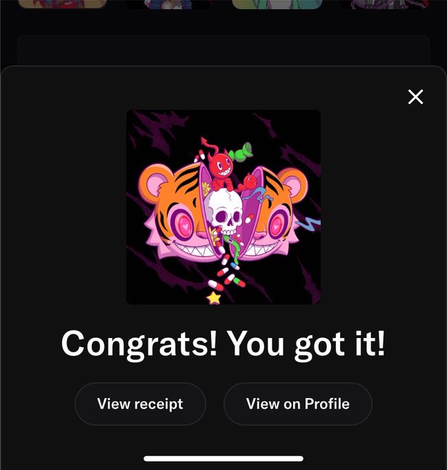 A mobile app screenshot displaying a reward notification that reads 'Congrats! You got it!' above a stylized graphic of a skull with pink glowing eyes, alongside 'View receipt' and 'View on Profile' buttons.