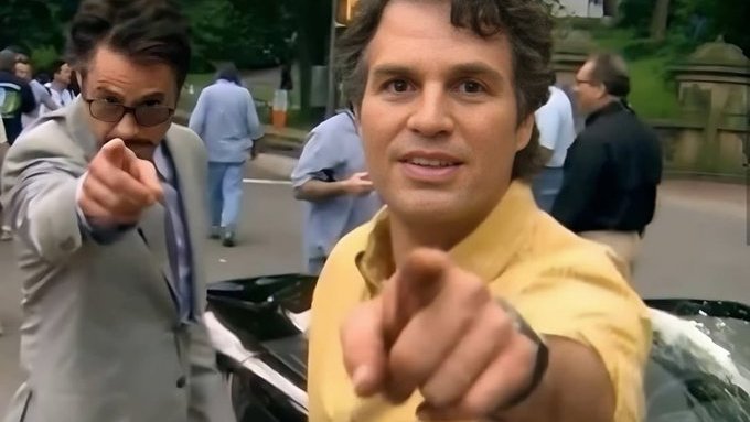 The image appears to be from the 2013 film "Anchorman 2: The Legend Continues," showing actors Steve Carell and Will Ferrell in a publicity-style shot, both pointing at the camera. The accompanying post humorously suggests the image is so iconic that viewers will share it widely, playing on the "breaking news" meme format to encourage engagement.