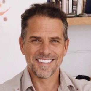 The image features a man with a beard, wearing a tan shirt, smiling at the camera. The caption of the image reads "NEW: Hunter Biden suggests Hyperliquid could help defeat Sen. Elizabeth Warren's anti-crypto army." This statement is related to the content in the image and emphasizes the importance of cryptocurrency in today's political climate.

The man appears to be a well-known actor, as suggested by his attire. The caption also mentions that the post was created by Hunter Biden for his Instagram account.