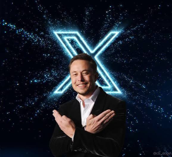A digitally edited image of Elon Musk smiling with his arms crossed, with a glowing blue X logo behind him against a starry space background, and 'XCOIN' text visible in the corner.