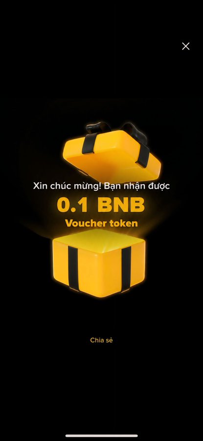A digital pop-up notification on a black background featuring yellow gift boxes and the text 'Xin chúc mừng! Bạn nhận được 0.1 BNB Voucher token' and 'Chia sẻ'.