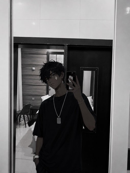 A black-and-white mirror selfie shows a person with dark hair, glasses, and a black t-shirt taking a photo with a smartphone while wearing a dog tag necklace. The aesthetic, moody photo fits the casual "gm" (good morning) weekend greeting vibe from the post, projecting a cool, low-key weekend energy.