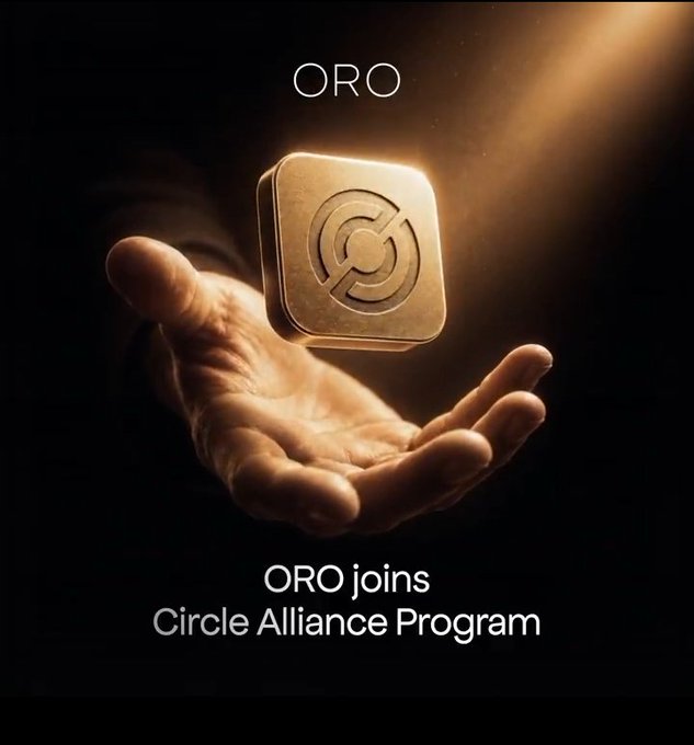 An open palm reaches toward a golden square token bearing a circular emblem, illuminated by a dramatic beam of light. Text reads "ORO" at the top and "ORO joins Circle Alliance Program" at the bottom, visually reinforcing the announcement of ORO's partnership with Circle to advance USDC adoption and onchain finance accessibility.