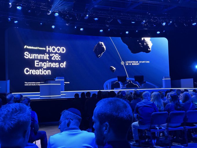 A crowded auditorium at the Rebuild Presents HOOD Summit '26: Engines of Creation event, with a large screen displaying space-themed visuals and the message 'LIVESTREAM STARTING IN A MOMENT'.