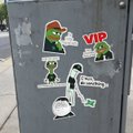 A gray utility box is covered in stickers, including one labeled "VIP" and cartoon characters, with someone having drawn a bicycle over the stickers. The context of "Ragebait?" suggests the bike doodle, possibly added uninvited over the VIP sticker, is meant to provoke an annoyed reaction.