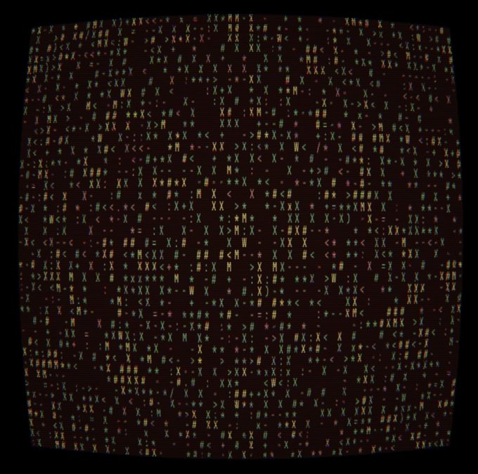 The image shows a dark screen filled with colorful ASCII characters arranged in a curved, screen-like pattern on a black background, evoking the appearance of code or digital data. This abstract computer-generated artwork visually represents the "Signal Receiving" mint mentioned in the post, with the scattered letters and symbols symbolizing incoming digital signals or data transmission associated with the NFT project.
