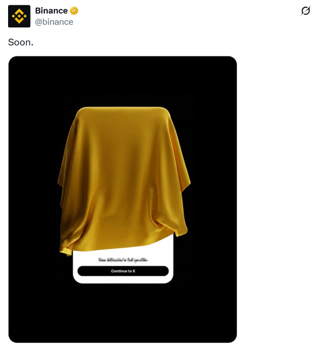 A tweet from Binance (@binance) with the text 'Soon.' showing a 3D-rendered image of an object draped in a yellow cloth, resembling an upcoming product reveal with a 'Continue to X' button.