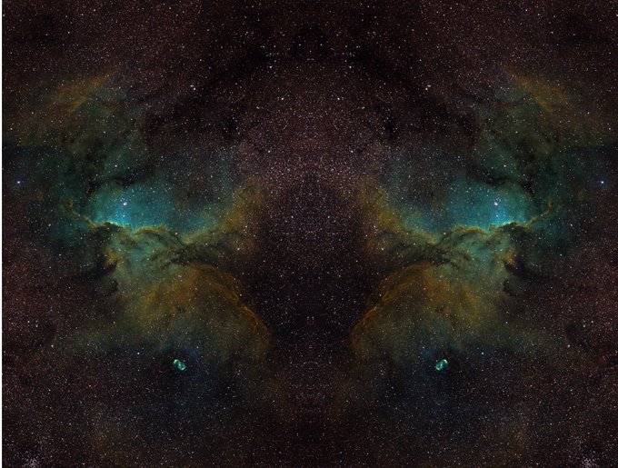 A symmetrical, mirrored view of a starry night sky with nebulae clouds in orange and teal hues against a dark background filled with stars.
