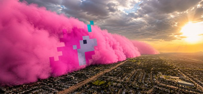 The image features an aerial view of a city with pink smoke coming out of the top left corner, creating a unique and eye-catching effect against the backdrop of the sky. The text at the bottom of the image reads "In plain English: Basically, with just 0.1 ethereum:0x44b28991b167582f18ba0259e0173176ca125505, you can redeem