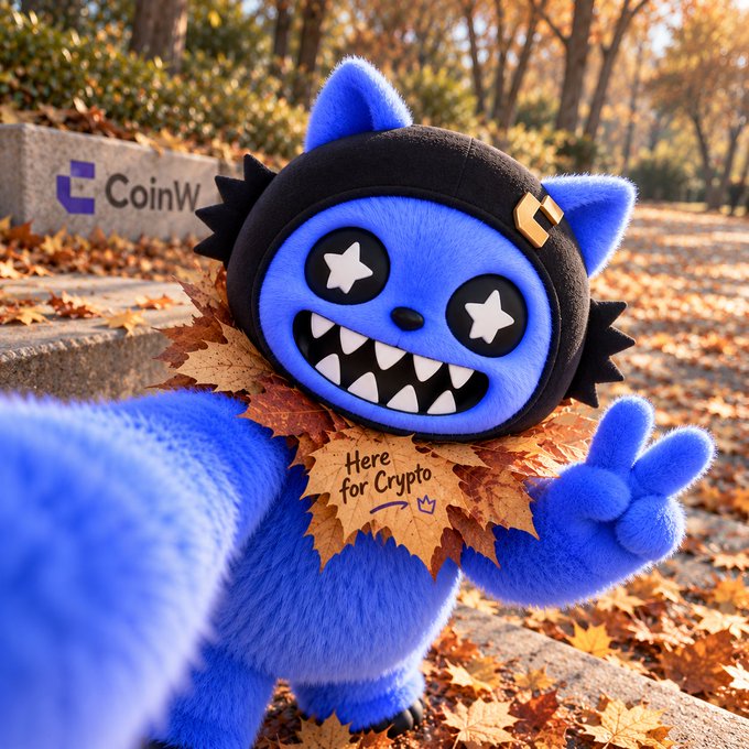 A blue furry mascot character wearing a black hood with star eyes and a sharp-toothed grin, surrounded by autumn leaves, with a leaf tag reading 'Here for Crypto' and the 'CoinW' logo visible in the background.