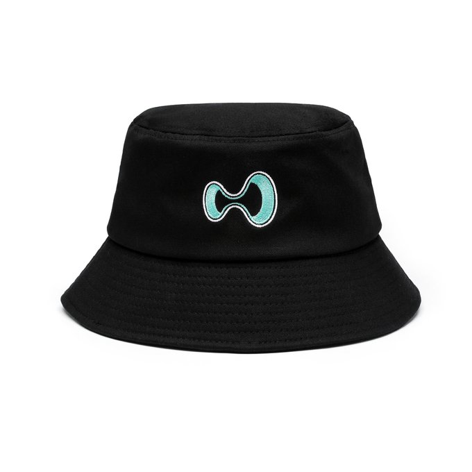 A black bucket hat featuring a teal Hyperliquid logo embroidered on the front, teasing the brand's upcoming full collection available on their merchandise store.