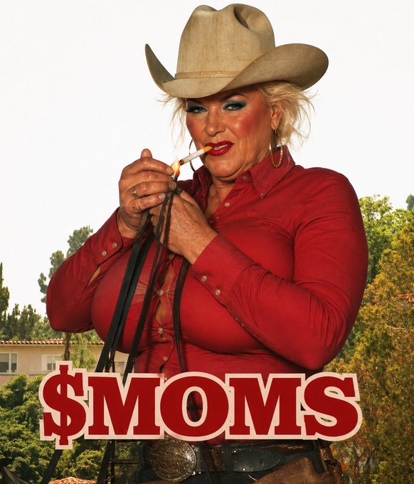 A poster showing an older woman in a cowboy hat and red shirt lighting a cigarette, with the text '$MOMS' prominently displayed at the bottom.