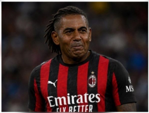 A close-up photo of AC Milan soccer player Kevin-Prince Boateng wearing the team's black and red striped jersey with 'Emirates FLY BETTER' and 'MSC' sponsor logos.