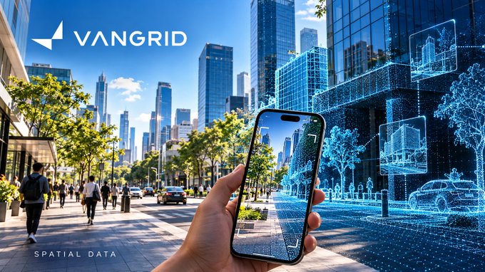 An advertisement for 'VANGRID' showing a hand holding a smartphone displaying an augmented reality view of a city street, with 'SPATIAL DATA' text at the bottom.