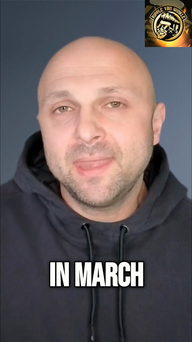 The image features a bald man wearing a black hoodie, with the text "In March" written below his head. There are no other people or objects visible in the photo. The caption reads "Ripple didn'T apply for a seat at the table. They were already sitting in it." and "$XRP".