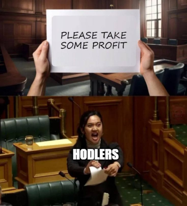 A meme depicting a person labeled "HODLERS" angrily tearing up a sign that reads "PLEASE TAKE SOME PROFIT," illustrating the crypto community's refusal to sell their holdings regardless of market conditions.