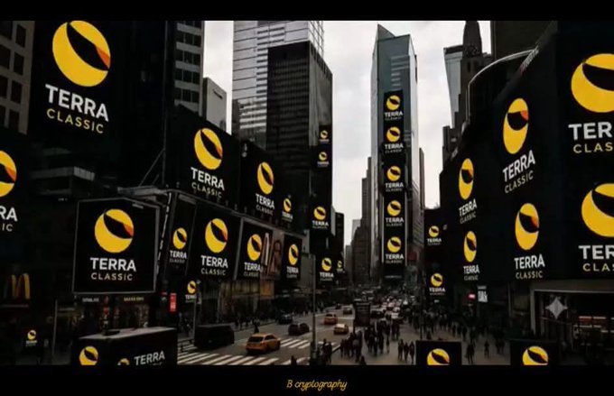 A bustling cityscape resembling Times Square is covered in multiple billboards displaying the "TERRA CLASSIC" logo with its distinctive yellow and black eye-like symbol. The imagery reinforces the post's message of LUNC's resurgence, depicting widespread visibility and prominence for the Terra Classic brand amid a sea of urban advertising.