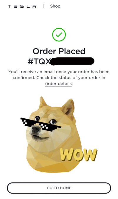 The image features a smartphone screen displaying an order placed by a customer at a Tesla store, with a green checkmark indicating that their order has been confirmed. The text on the screen reads "Order Placed #TQX", which is likely the order number for the customer's purchase. A sticker of a dogecoin character wearing sunglasses and glasses is also present in the image. The post mentions that the order was placed using Dogecoin, which could be an indication that the customer used cryptocurrency to pay for their Tesla merchandise.