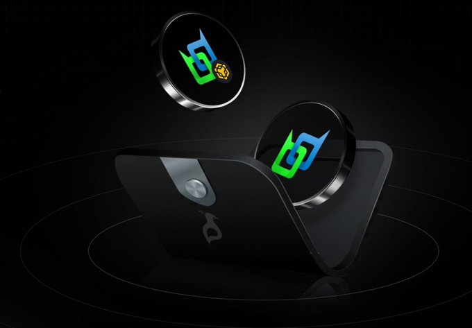 A digital render of two dark metallic coins featuring a green and blue interlocking logo floating above a black wallet-like device against a dark gradient background.