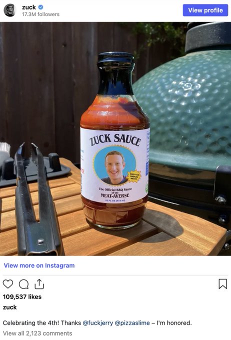 An Instagram post from 'zuck' (17.3M followers) celebrating the 4th of July, showing a bottle of 'ZUCK SAUCE' BBQ sauce with his face on the label, credited to @fuckjerry and @pizzaslime.