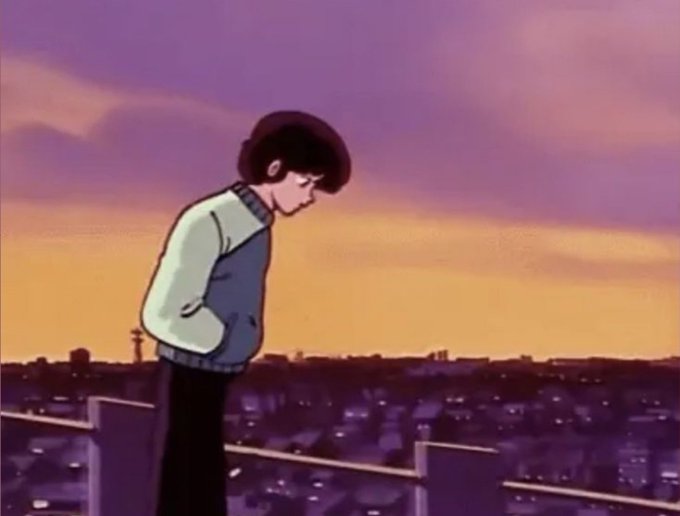 An anime character stands on a rooftop at sunset, gazing down at a sprawling city while keeping their hands tucked into their hoodie pockets. The melancholic sunset scene complements the casual "Gm guys" greeting, evoking a reflective and peaceful morning vibe.