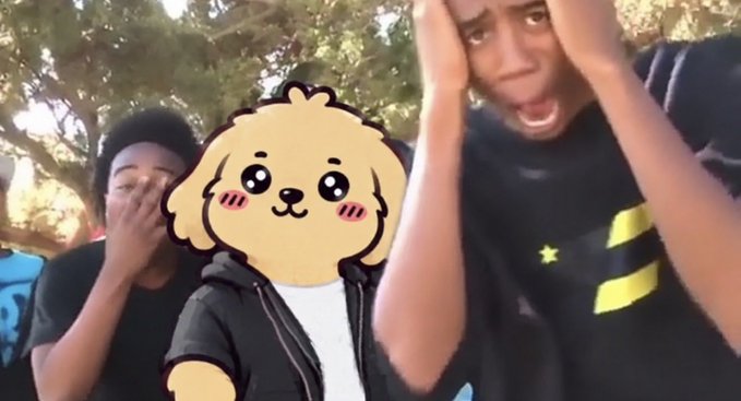 A meme-style image showing two shocked young men outdoors, with a cartoon dog face sticker covering one person's face.