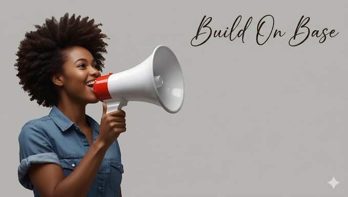 An image of a smiling woman with an afro holding a megaphone, accompanied by elegant cursive text reading 'Build On Base'.