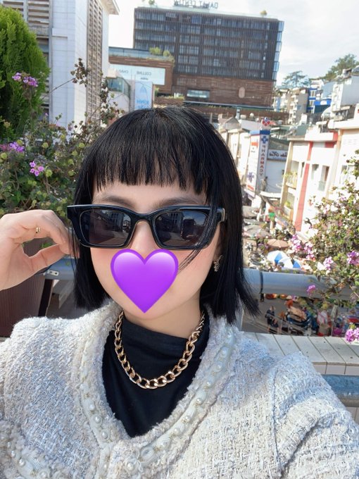 iced tea with a heart-shaped lid, sunglasses, and a chain necklace are featured on the cover of a photo.