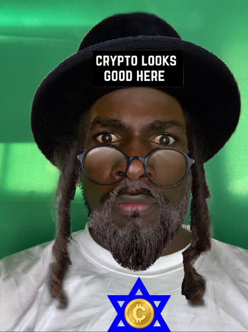 A meme-style image of a man in a hat and glasses labeled 'CRYPTO LOOKS GOOD HERE' with a Bitcoin Star of David symbol overlaid on a green background.