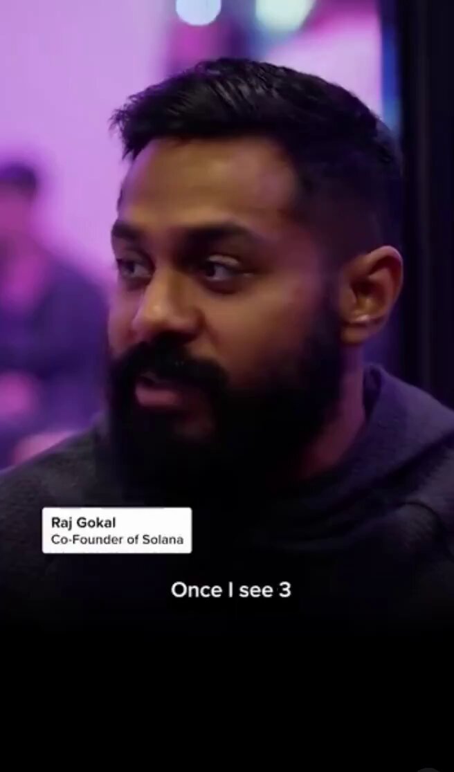 The image shows a man with a beard wearing a black hoodie, looking at something off-camera while standing next to a purple wall. The caption of the image reads "Once I see 3". This suggests that there might be an event or project related to the man's name and interests, possibly involving robotics, artificial intelligence, or other fields where he has expertise.