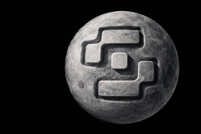A spherical moon-like 3D rendered object featuring a stylized geometric logo or symbol carved into its gray cratered surface against a black background.