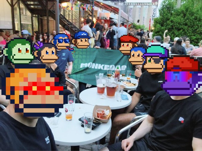 The image shows a group of people sitting at tables outside, enjoying their time together with food and drinks. There are several individuals wearing sunglasses and hats, indicating that they might be spending some leisurely time outdoors during the day. The scene appears to take place in an outdoor cafe or restaurant setting, as there is a table full of cups and glasses on one side, suggesting that people have been drinking and socializing.

The image also includes a post about Solana communities across Canada going strong, which could be related to the gathering taking place in the scene. The post might be discussing the popularity or success of these communities within Canada, or it could be promoting an event or activity involving Solana communities.