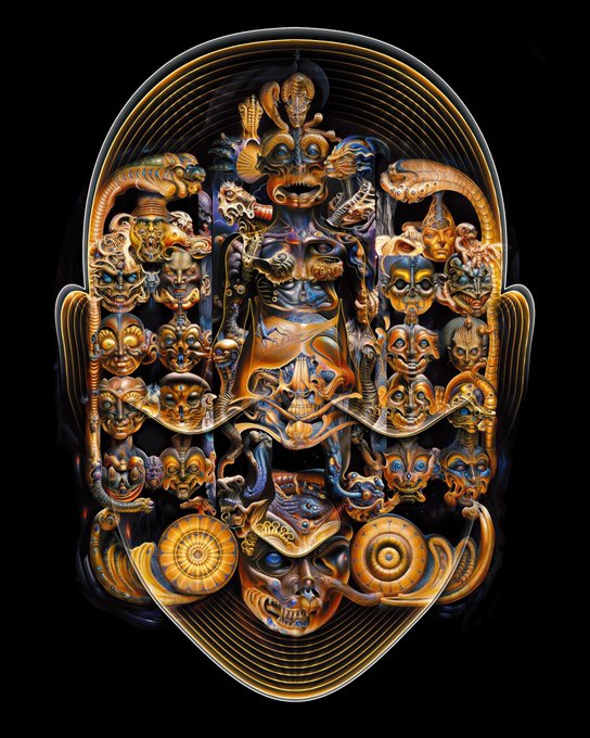 An intricate, ornate golden mask sculpture featuring numerous detailed faces, skulls, and ornate carvings set against a black background.