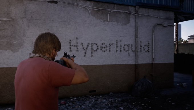 A person in a red shirt aims a rifle at a concrete wall marked with bullet holes spelling out the word 'Hyperliquid'.