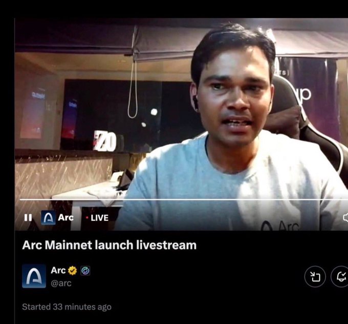 A livestream titled 'Arc Mainnet launch livestream' from the account Arc (@arc), marked as LIVE and started 33 minutes ago, showing a man wearing earbuds in a room with monitors.