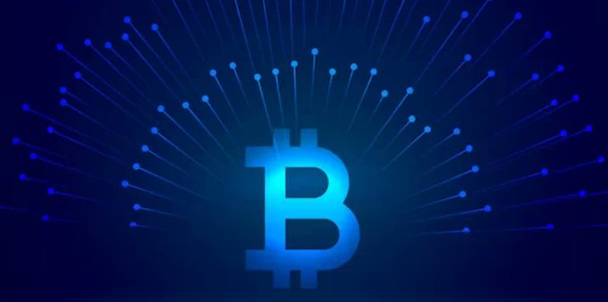 A stylized digital illustration of the Bitcoin logo glowing in blue against a dark background with radiating light beams suggesting a network or blockchain connection.