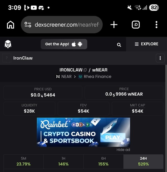 A mobile screenshot of dexscreener.com displaying the IRONCLAW/wNEAR token pair on Rhea Finance with a price of $0.04564 USD, 0.05966 wNEAR, $28K liquidity, $54K FDV/MKT CAP, and 24H gain of 529%, along with a Rainbet crypto casino ad.