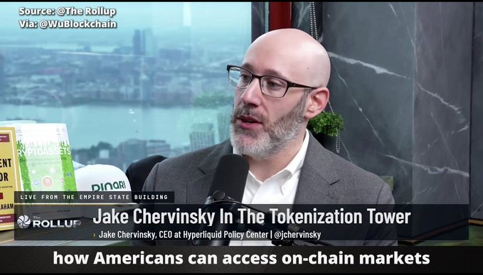 A screenshot from 'The Rollup' interview featuring Jake Chervinsky, CEO at Hyperliquid Policy Center, with subtitle reading 'how Americans can access on-chain markets' and credits 'Source: @TheRollup Via: @WuBlockchain'.