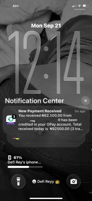 An iPhone lock screen showing the time 12:14 on Mon Sep 21, displaying a notification from OPay about a 'New Payment Received' of N82,500.00, with the wallpaper showing jeans and the nickname 'Defi Rey' visible.