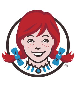 The image shows a cartoon depiction of Wendy's, the well-known fast food restaurant, with a female face that resembles a red-haired girl wearing blue hair and blue bow ties. The logo for Wendy's includes a stylized version of the company's name, set within a black circle or ring against a white background. The image also contains text that states "Just In: Wendy's jumps 30% after WallStreetBets traders rally behind a viral". This suggests that there has been some positive news related to Wendy's, and it has reached a considerable amount of attention on social media platforms like reddit.