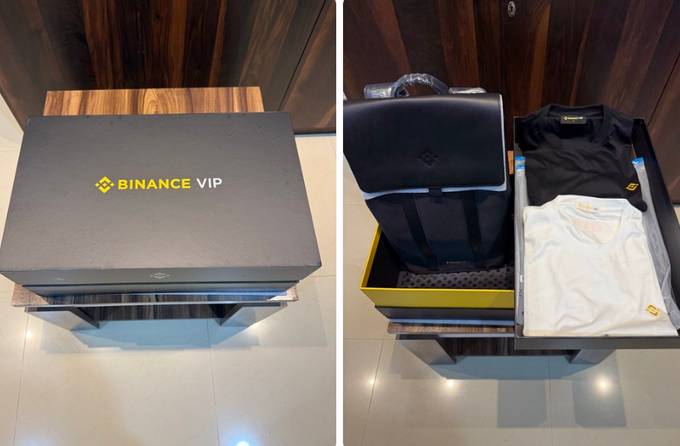 Two images showing a black 'BINANCE VIP' gift box, with the right side revealing its contents: a black suitcase, folded shirts, and a black cap.
