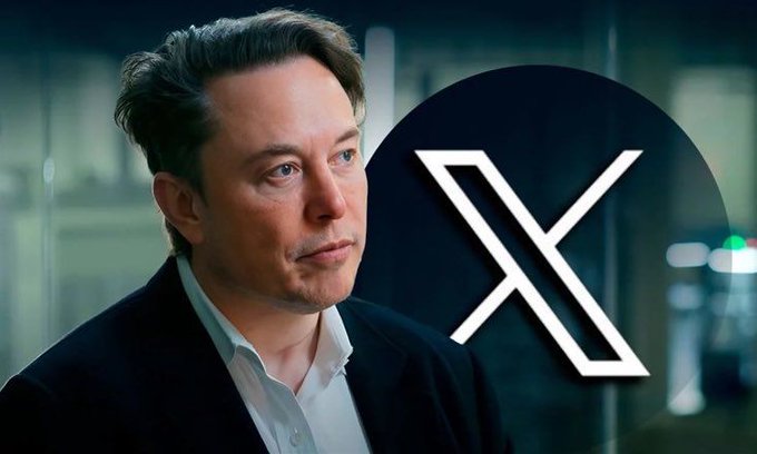 Photo of Elon Musk in a dark suit and white shirt, with the X (formerly Twitter) logo displayed prominently beside him.