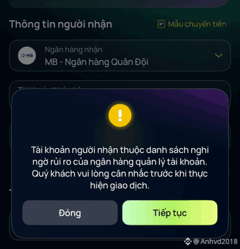 A Vietnamese banking app warning that the recipient's account is on a high-risk blacklist managed by the bank, with 'Đóng' (Close) and 'Tiếp tục' (Continue) buttons, showing MB Bank as the receiving bank.