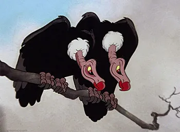 Two cartoon vultures with red lipstick and white fluffy head tufts perch hunched on a bare branch. The "iykyk" caption plays on the classic vulture stereotype—pairing up "like two vultures"—as an inside-joke reference for those familiar with the trope.