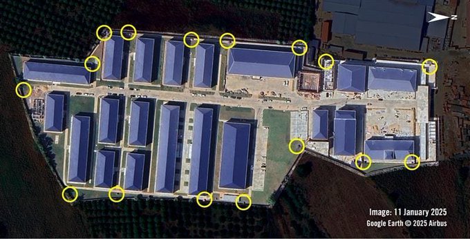 An aerial satellite view, dated 11 January 2025 (Google Earth © 2025 Airbus), of an industrial complex or camp with blue-roofed structures, with several points circled in yellow around the perimeter.
