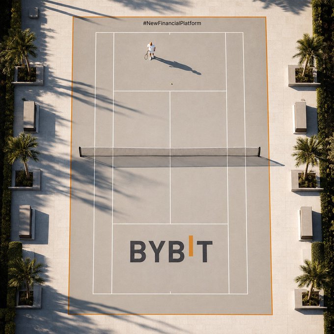 An aerial view of an outdoor tennis court branded with 'BYBIT' at the net, featuring a hashtag '#NewFinancialPlatform' at the top, with a person standing in the upper service box casting a long shadow.