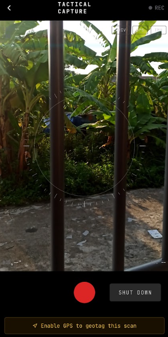 A mobile app interface labeled 'TACTICAL CAPTURE' shows a camera view of tropical banana plants, with a red record button and a 'SHUT DOWN' button visible.