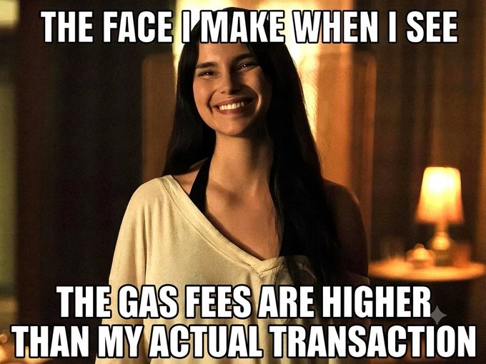 A meme featuring a smiling woman with text reading 'THE FACE I MAKE WHEN I SEE' above and 'THE GAS FEES ARE HIGHER THAN MY ACTUAL TRANSACTION' below.