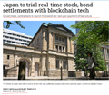 The photo shows a building with a sign reading "NIPPON STEEL" alongside an image of a steel structure, with a caption noting "Japan to trial real-time stock, bond settlements with stablecoin tech." The image illustrates the financial sector infrastructure in Japan undergoing the blockchain-based settlement experiment mentioned in the post, which involves securities firms, megabanks, and companies like SBI Securities exploring stablecoin-settled trades for JGBs, corporate bonds, investment trusts, and stocks.